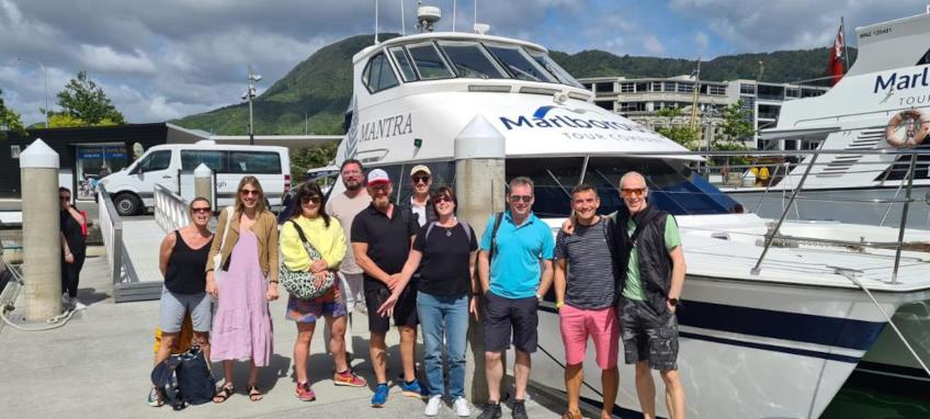 Team lined up outside the boat