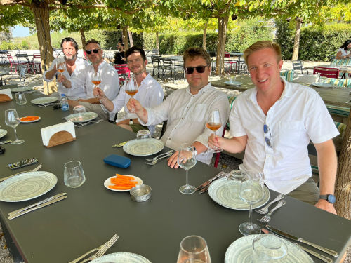 Group drinking wine outdoors