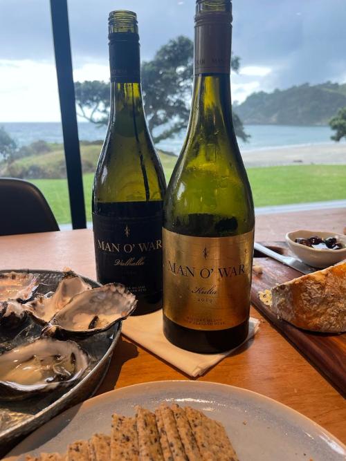 Some bottles with oysters and nibbles