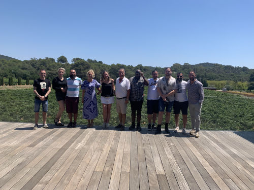 The group outside the winery in the sun