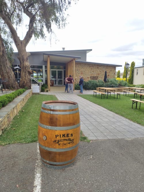 A Pikes branded wine barrel in front of the winery