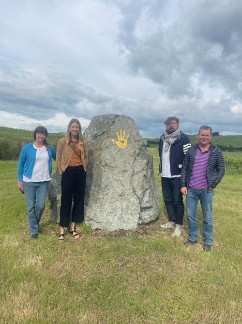 The team stood in front of the Seresin handprint rock