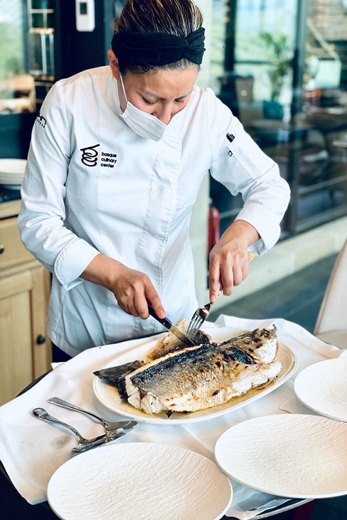 Chefs prepare fish in Sierra Cantabria's El Puntido restaurant