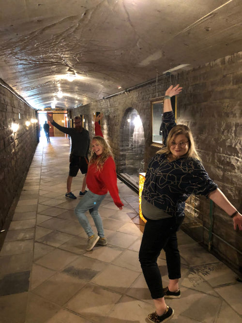 Team walking through the cellars